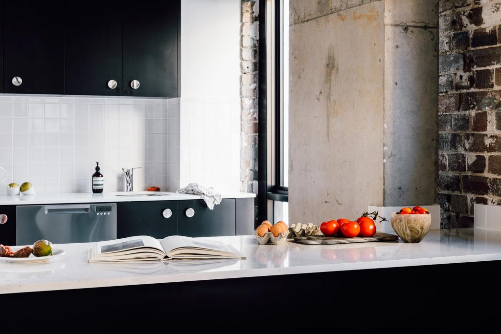 veriu-broadway-kitchen-bench-with-magazine-fruit-and-eggs kitchen space at Veriu Broadway