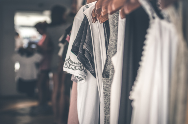 a close up shot of nice clothes of a rack