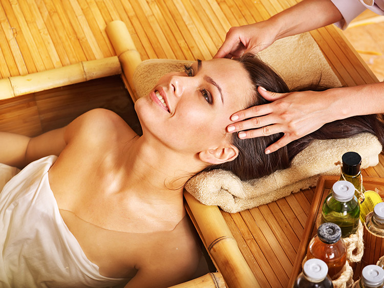 a lady getting a head massage at a massage parlour