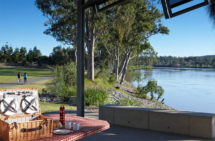 a picnic setup and view of the river at rocks riverside park