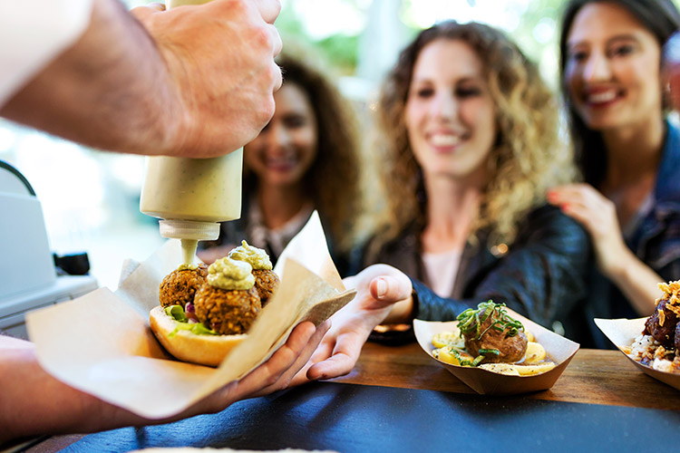 three women waiting for their food