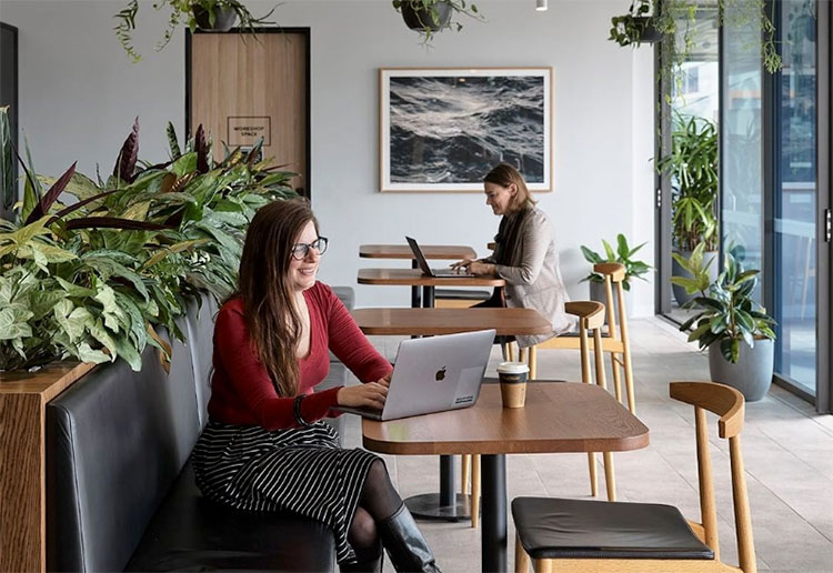 a woman sitting at a coworking space in melbourne