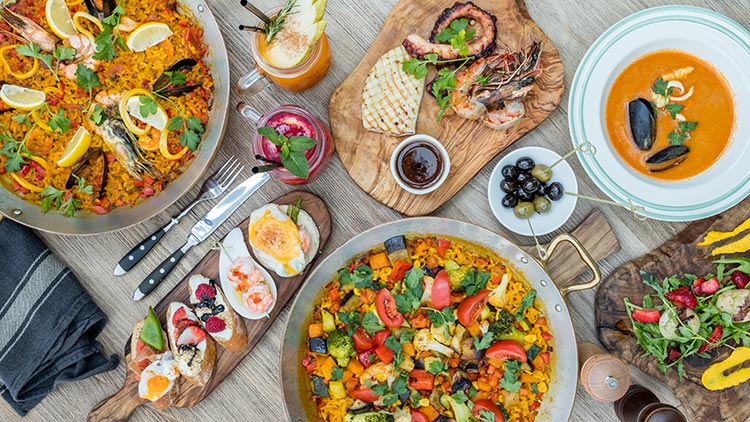 a platter of spanish food on the table